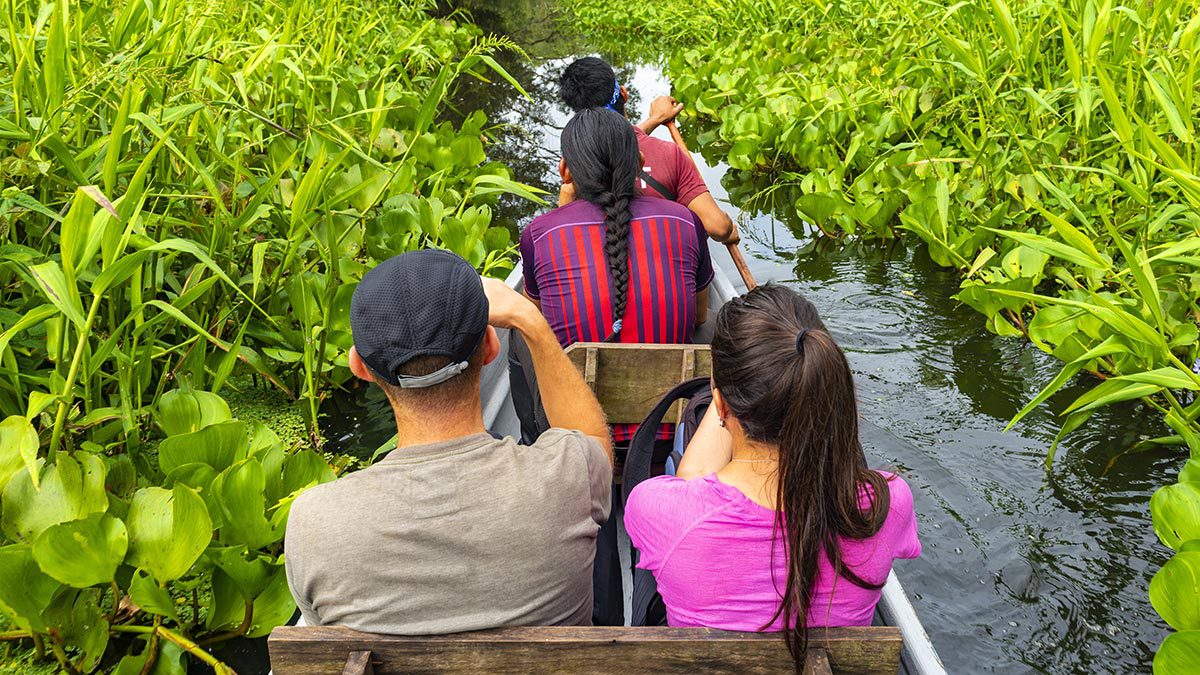 Sustainable Travel Practices: How to Explore the World Responsibly - Blog Image Amazon boat tour with local guide Top 10 Tips for Sustainable Travel - Sustainable Travel International
